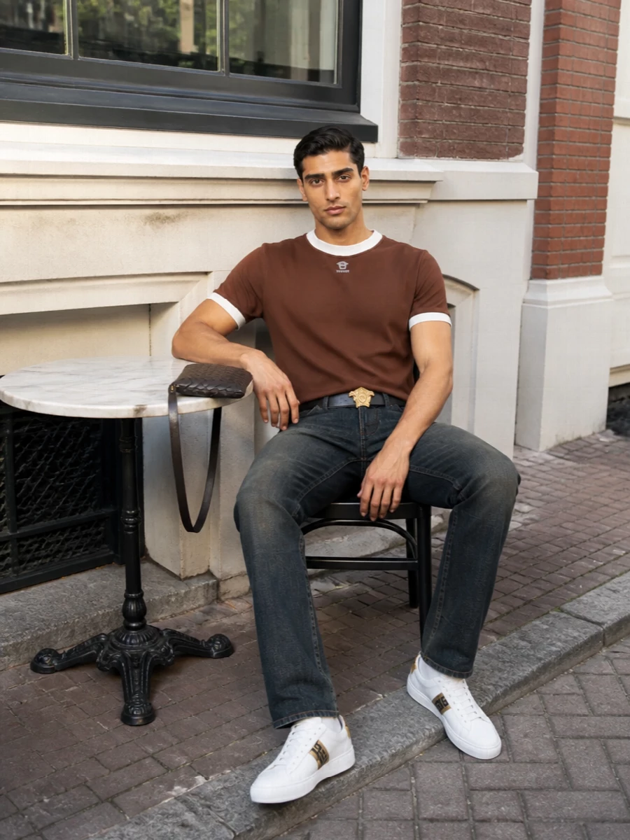Versace brown tee dark jeans white sneakers