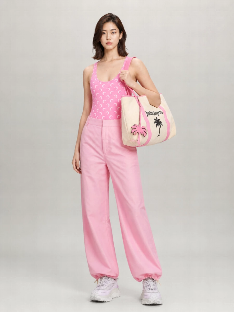 Marine Serre’s crescent-moon bodysuit meets glossy Marni drawstring trousers for a bubblegum-pink, sport-leaning statement that feels playful but sharply curated. Chunky Moncler trail runners keep it technical and grounded, while the oversized Palm Angels tote adds a graphic, street-led finish that lets the pink read intentional rather than sweet.