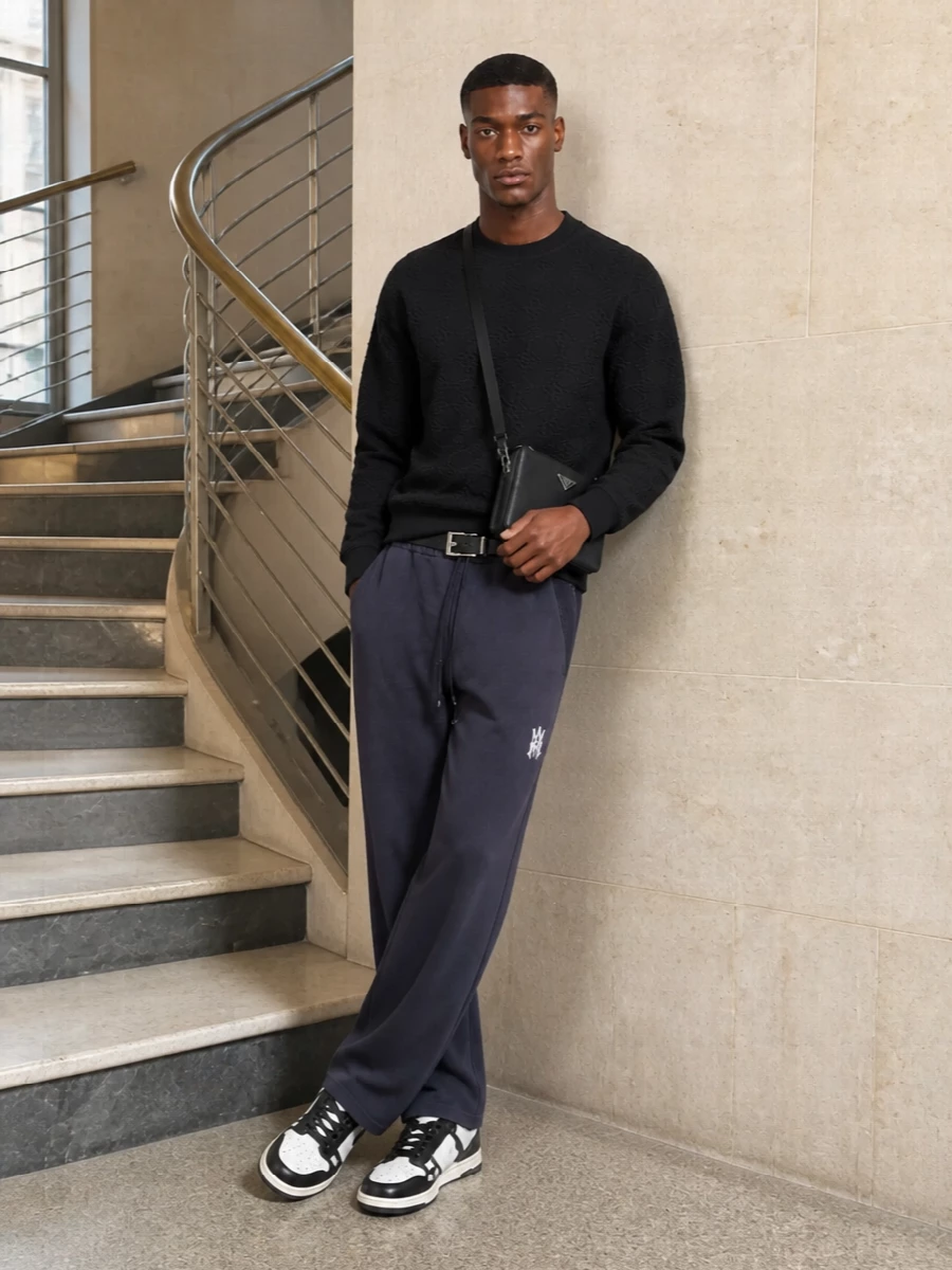 Amiri black sweatshirt track pants prada bag