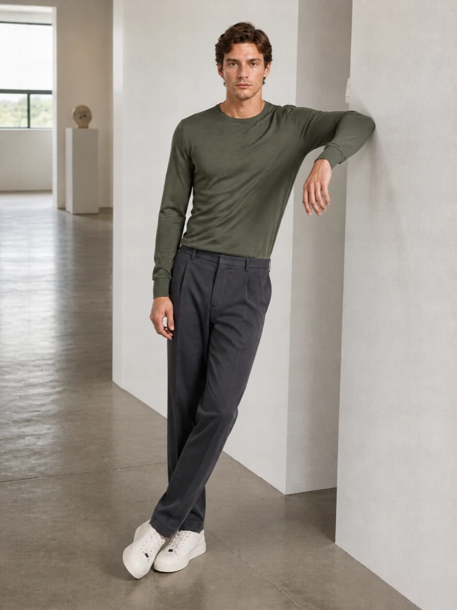 Muted olive and charcoal create a calm, tailored foundation that feels considered without trying too hard. Off-white leather and canvas details lighten the palette, keeping it fresh for warmer days. The result is a quietly polished uniform you can wear from studio hours to dinner in the city.