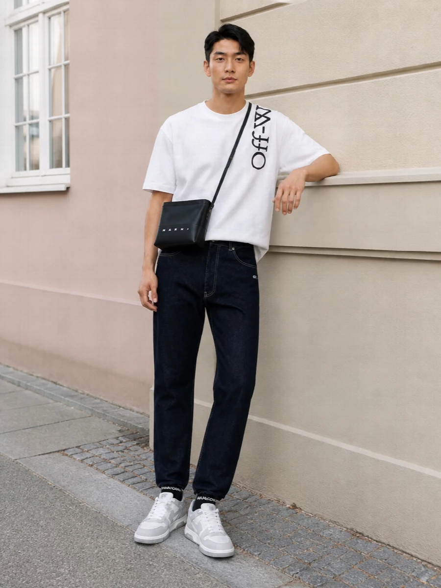 Off white tee dark denim sneakers outfit