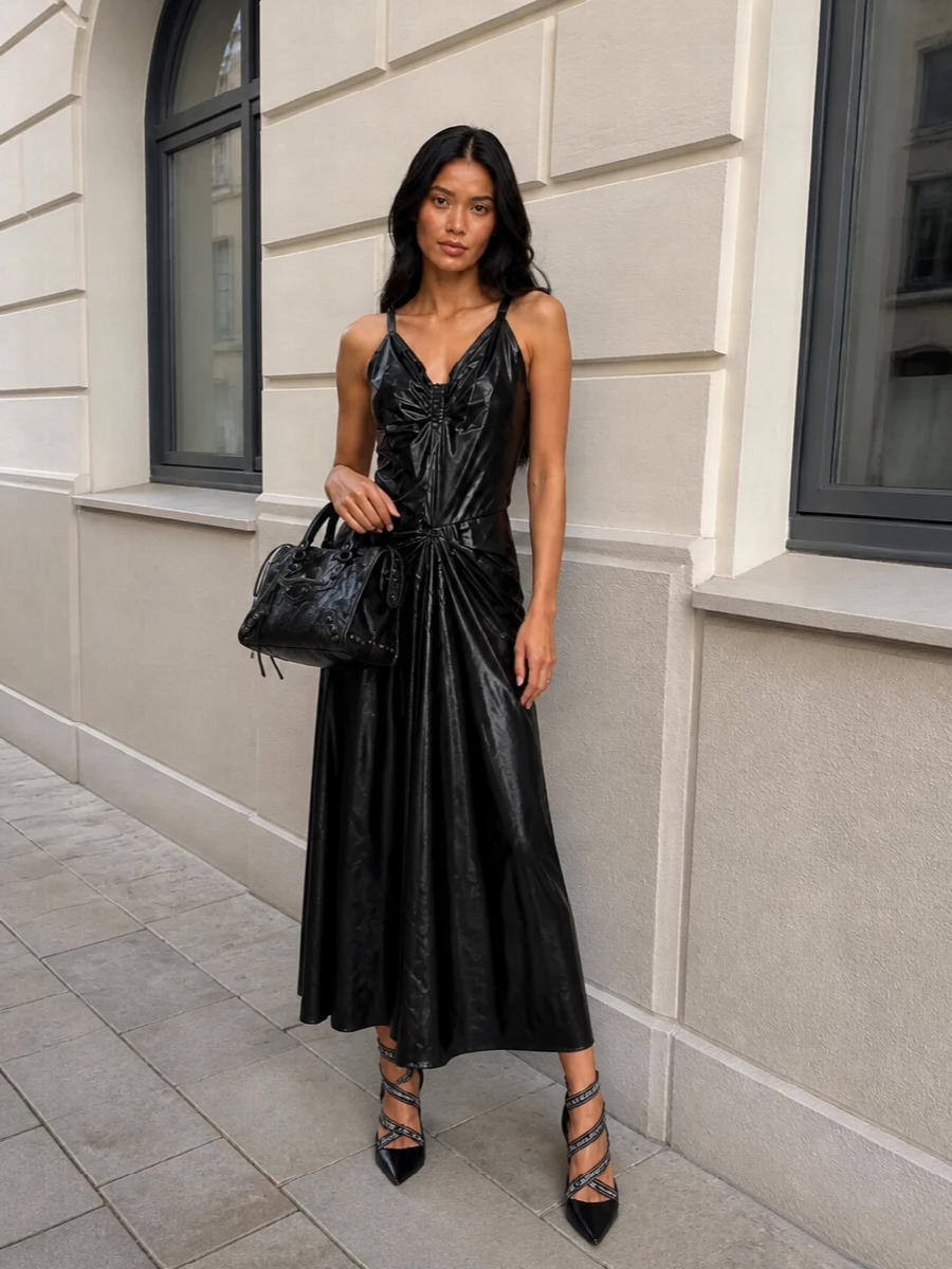 For this bag’s jet black, hardware-heavy attitude, the Margiela ruched maxi is the strongest match, keeping everything dark, glossy and nightlife-ready instead of breaking the line with separates. The liquid finish, body-skimming cut and subtle deconstruction feel subversive yet precise, so the bag reads like an intentional part of a ultra-modern, city-after-dark uniform. Balmain’s logo-cage stilettos pull in a touch of couture branding and height, amplifying the silhouette without diluting the underground edge.