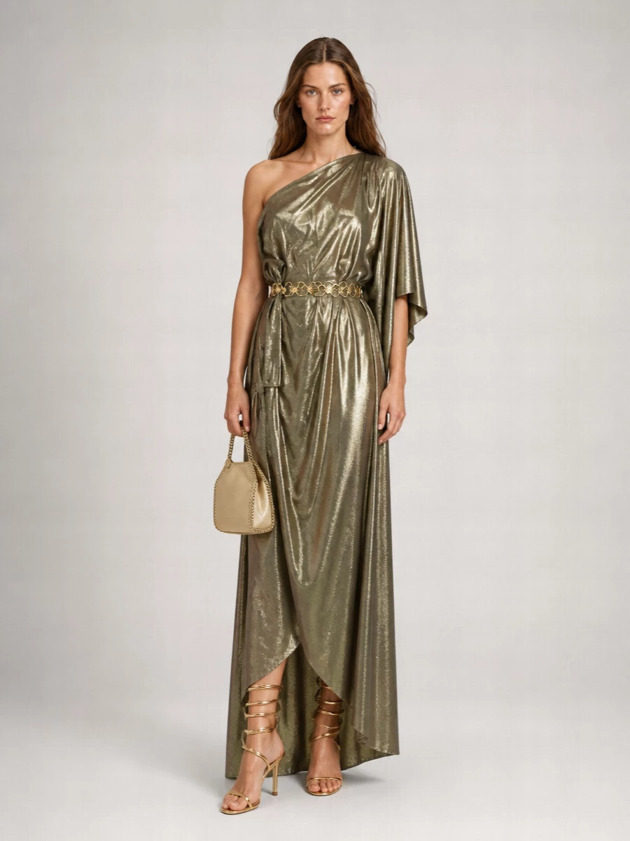 I styled the Versace chain belt over the Taller Marmo gold lamé maxi to double down on liquid-metal glamour while still defining the waist cleanly. Rene Caovilla spiral sandals and a champagne chain clutch keep the metallic story cohesive and y2k-leaning, but the long, draped silhouette and rich tones hold it firmly in luxury evening territory. The result is a high-formality, statuesque cocktail ensemble where the belt truly reads as body jewelry rather than an afterthought.