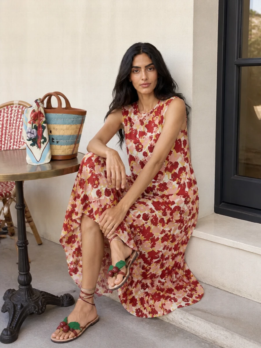 A fluid Marni floral maxi becomes the hero for sunlit days, grounded by whimsical Valentino vine sandals that echo its reds and greens. A sculpted Marni basket bag and painterly silk scarf keep the story romantic and boho, yet still refined enough for garden parties, long lunches or vacation dinners. The result is expressive and soft, but considered in every detail from color harmony to proportion.