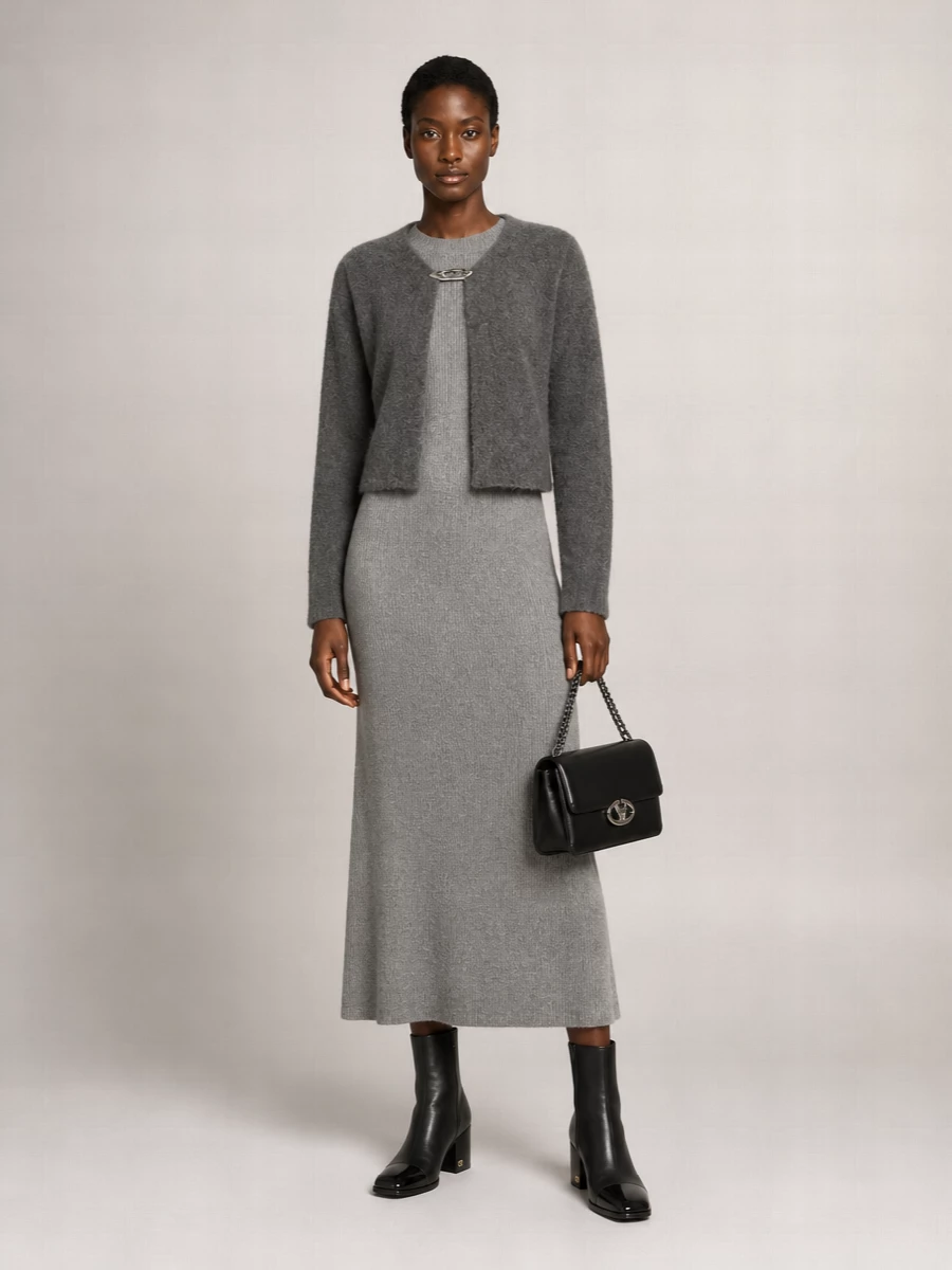 I’m styling the Bottega cardigan as outerwear over a single knit column, so the dress route is cleaner and more modern than adding another top layer and tailored bottom. The Fabiana Filippi grey ribbed dress continues the soft charcoal story with a long, refined line, while the Valentino ankle boots and structured black bag bring just enough polish for city days that slip into dinner. The result is a quiet, tonal knit ensemble that feels considered, expensive and intentionally understated rather than loungey.
