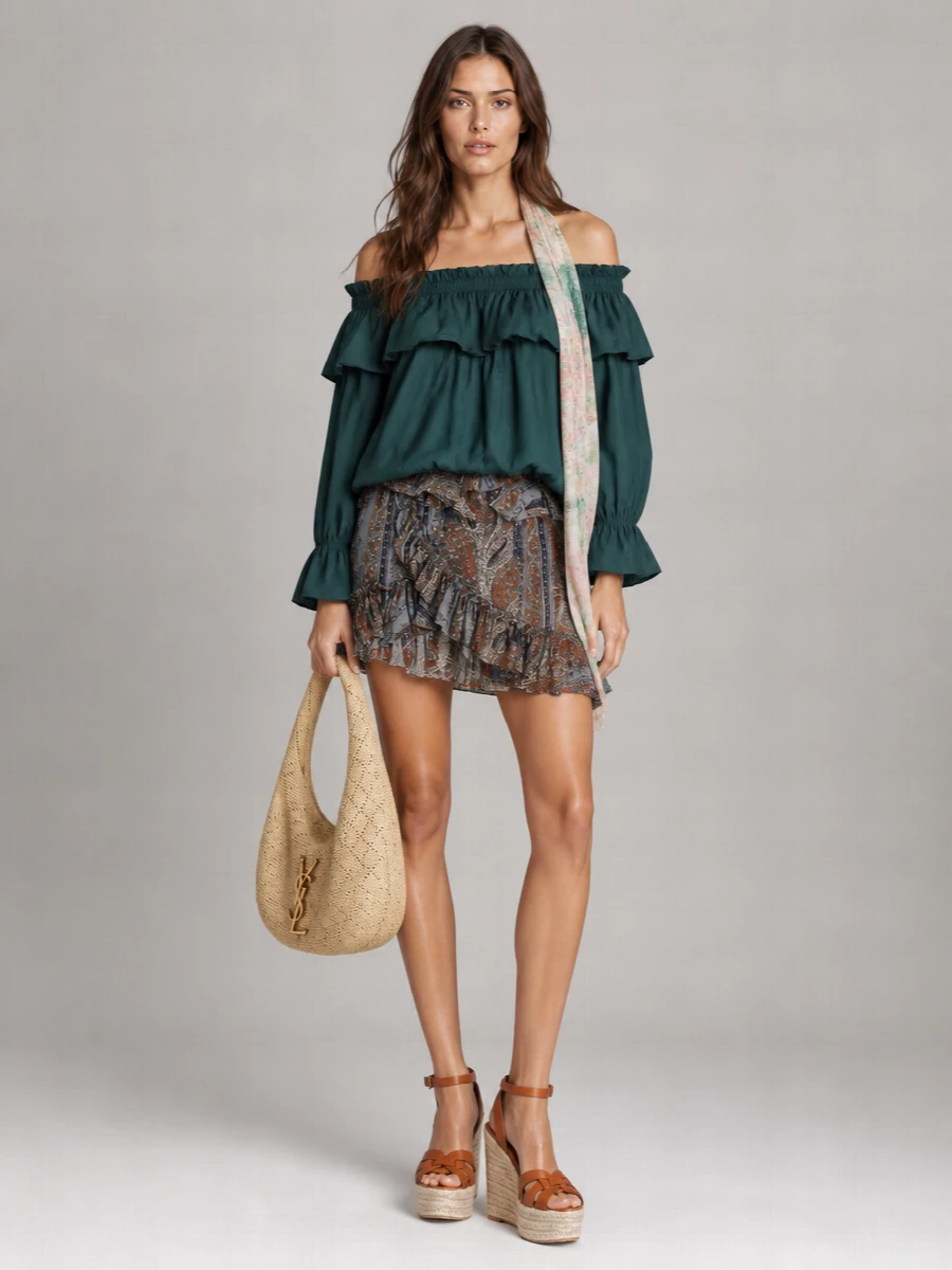 Deep teal ruffles meet a paisley mini for a romantic, leggy silhouette that feels made for warm city evenings or terrace dinners. Tan espadrille wedges and a woven hobo bag keep the mood relaxed yet refined, their natural textures grounding the movement of the blouse and skirt. A gauzy floral scarf introduces a soft wash of colour that quietly knits the palette together if you want an extra touch of poetry.