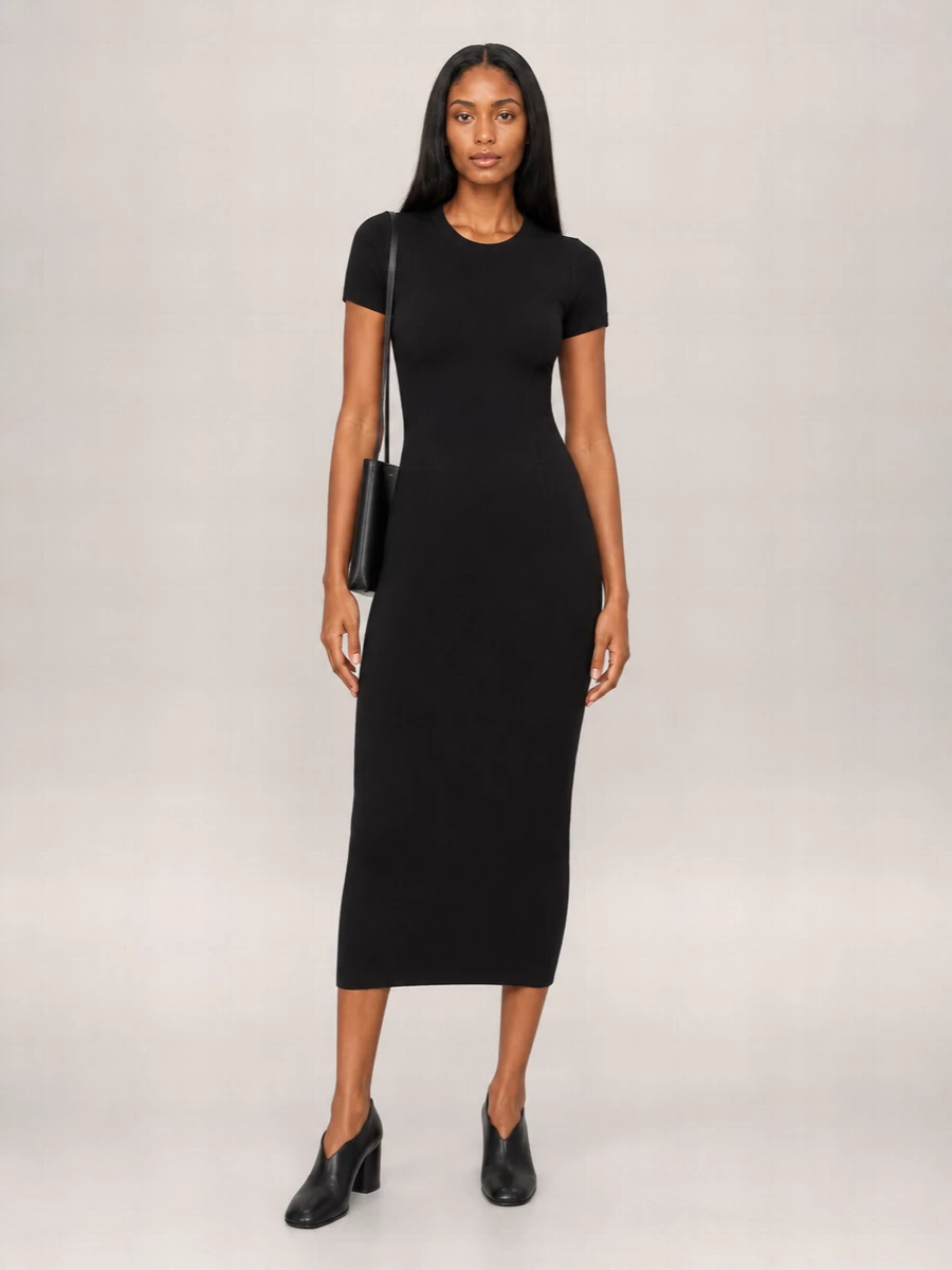 A precise black column punctuated with sculptural heels and a barely-there pouch keeps the mood restrained and assured. The all-black palette lets texture and line do the work, ideal for a boardroom day that ends at a discreet restaurant. Gold or pared-back silver jewelry would be all you need to finish it.