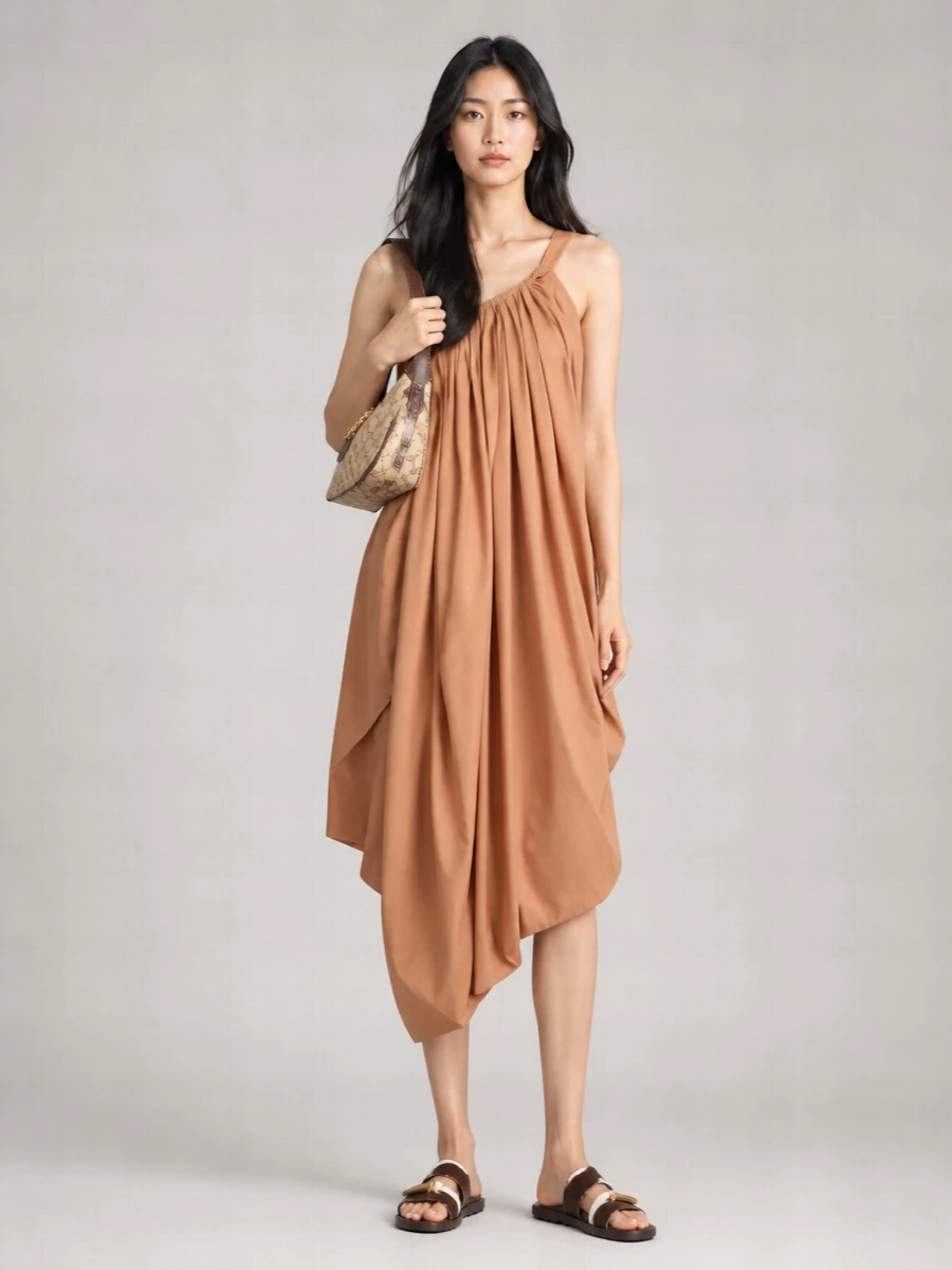 A sculptural camel Chloé midi and the Gucci Jackie-inspired shoulder bag create a warm, tonal base that feels polished yet relaxed. The tactile Tod’s flat slingback keeps the mood boho but quietly refined, ideal for sunlit city afternoons that drift into dinner.