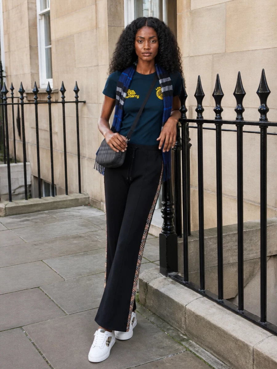 Burberry navy logo tee black track pants sneakers