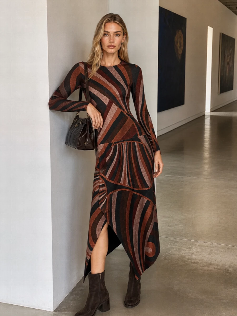 This pairing leans into the Prada bag’s deep espresso tone by framing it with Pucci’s asymmetric swirl dress in matching earthy browns, giving the whole ensemble a refined yet late‑90s inflected attitude. The graphic print keeps it young and slightly subversive against the bag’s structured minimalism, while the dark chocolate ankle boots keep the line long and grounded. Opting for the dress route instead of tailoring lets the bag read as the sharp, polished anchor against fluid movement and print.