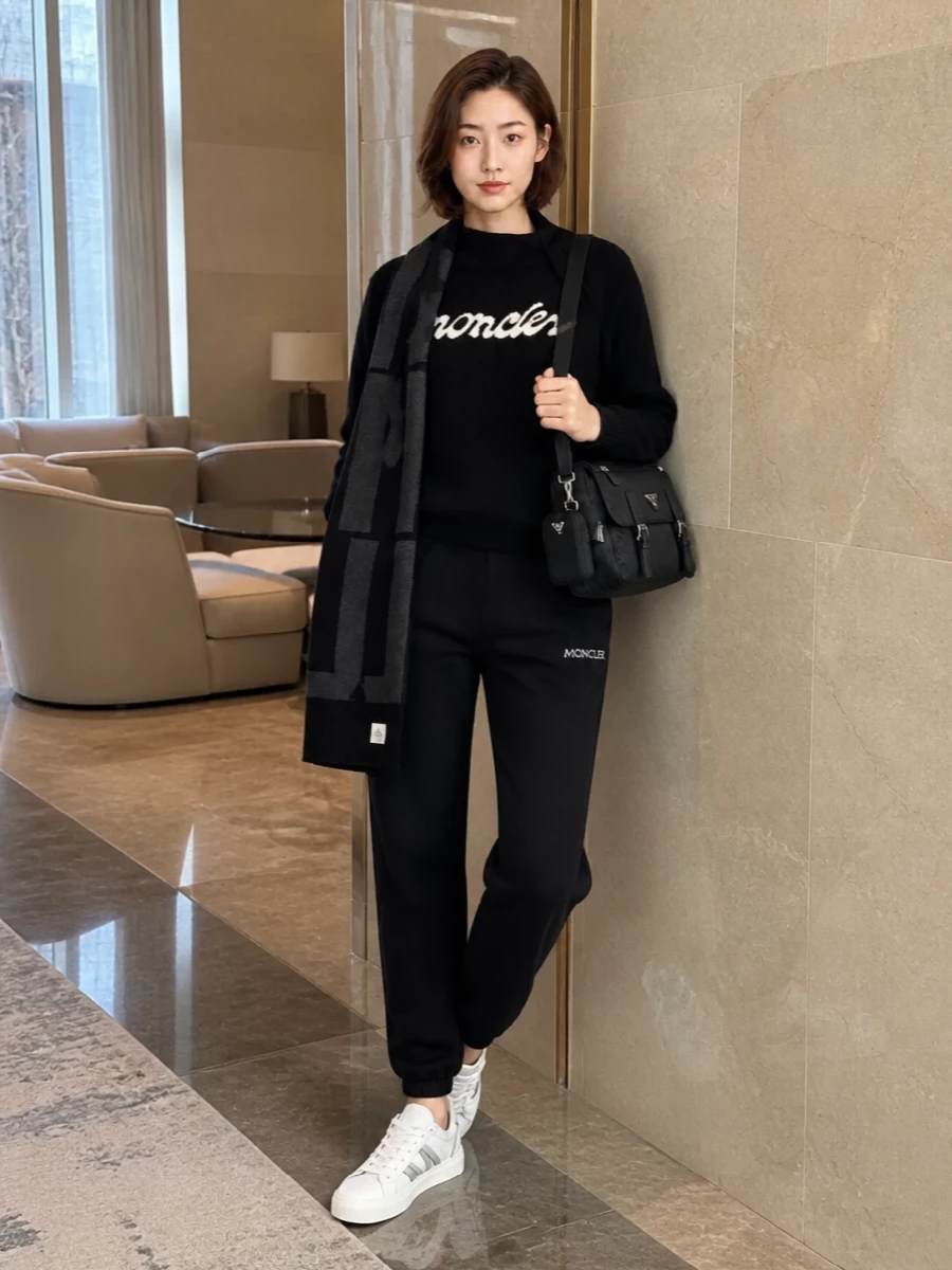 Moncler black joggers logo sweatshirt prada bag
