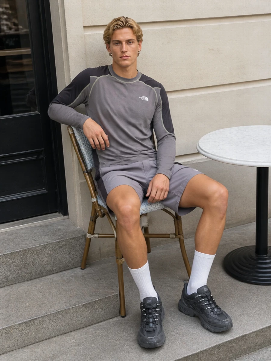 A trail-informed set built around muted greys and deep plum, this outfit feels ready for long, moving days without shouting. Technical textures and integrated belts keep everything practical, while the streamlined palette lets the performance details do the talking. Ideal for city commutes that spill into hikes or travel days spent on your feet.