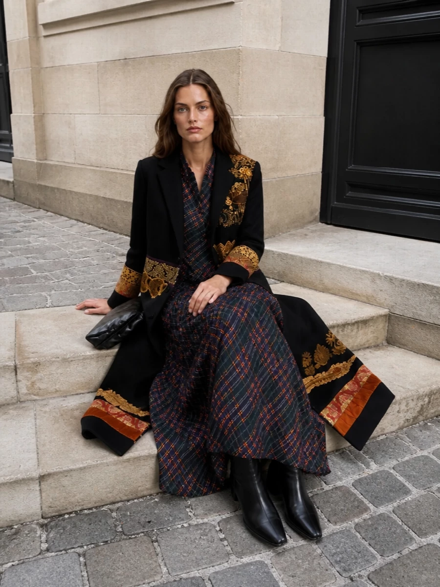 This is an art-world evening ensemble that lets the Dries coat stay the protagonist, with the long plaid dress quietly reinforcing its inky black, burnt orange and gold story. I chose the dress route over tailoring, as another blazer and trouser would overcomplicate the layers and shorten the coat’s sweeping line. The sculpted black wedge boots and glossy clutch keep everything sharp and directional, adding weight and polish without introducing competing texture or print.