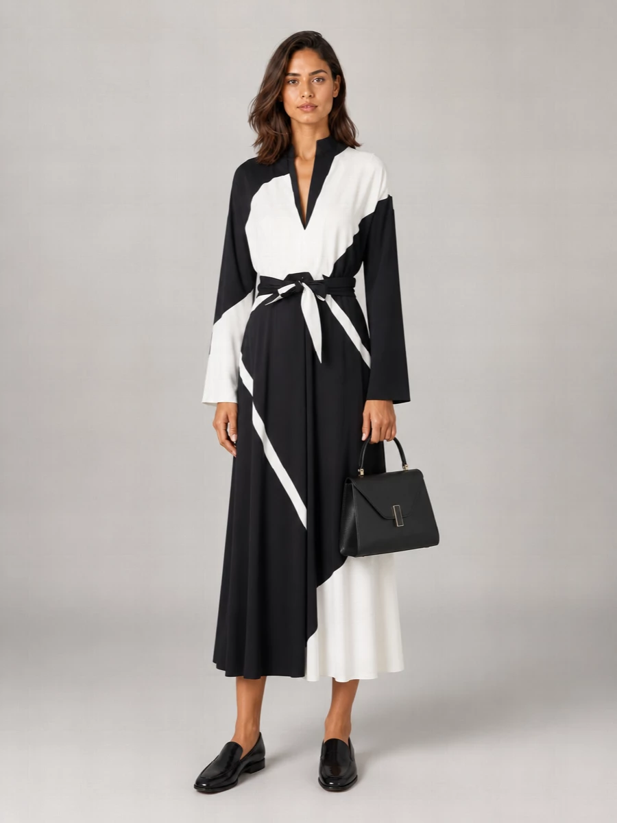 I’m taking the dress route here, using the Alberta Ferretti wrap midi to echo the Tom Ford cardholder’s graphic black and off-white minimalism in a single, precise gesture. The slipper loafer keeps the mood boardroom-capable yet cocktail-ready, and the Valextra top-handle adds that discreet, architectural structure that ties all the black leather together without shouting logos.
