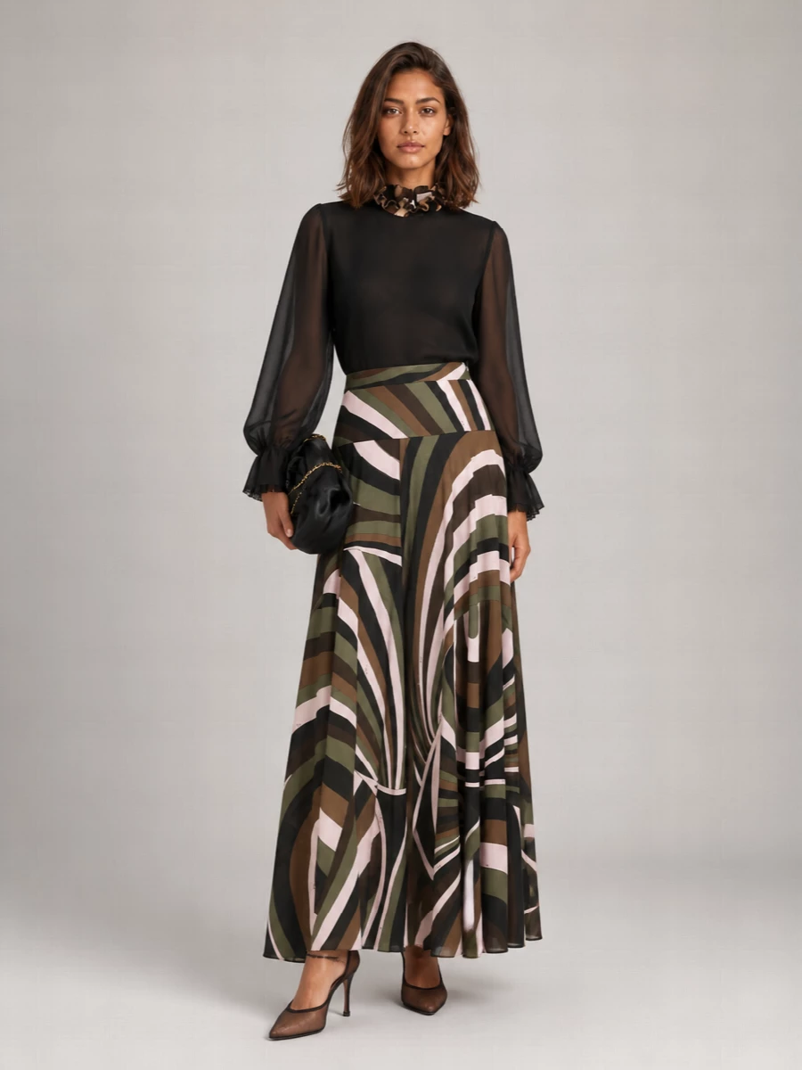 Sheer black romance meets Pucci’s grounded geometrics here, with the blouse floating over a sweeping olive and cocoa print maxi for a long, uninterrupted evening line. Chocolate mesh stilettos and a sculpted black clutch keep the mood quietly opulent rather than loud, letting the interplay of transparency and print do the work. A touch of matching Pucci print at the neck or bag subtly reinforces the story without crowding the silhouette.