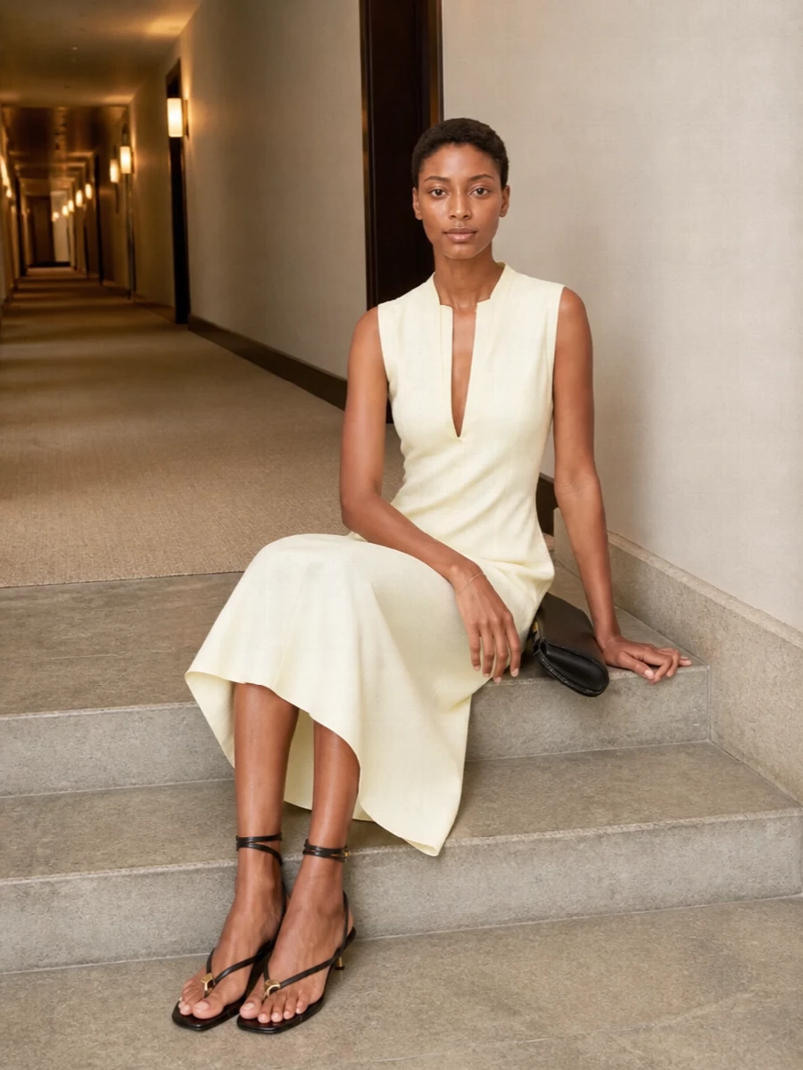 I’m anchoring this around the Jil Sander butter-yellow midi rather than separates, so the Margiela cuff reads as a single clean arc against uninterrupted color. Black and gold accessories sharpen the softness just enough, giving you a gallery-to-dinner ensemble that feels calm, precise and quietly expensive. The proportions stay long and lean, with every metal touch treated like a considered accent rather than decoration.