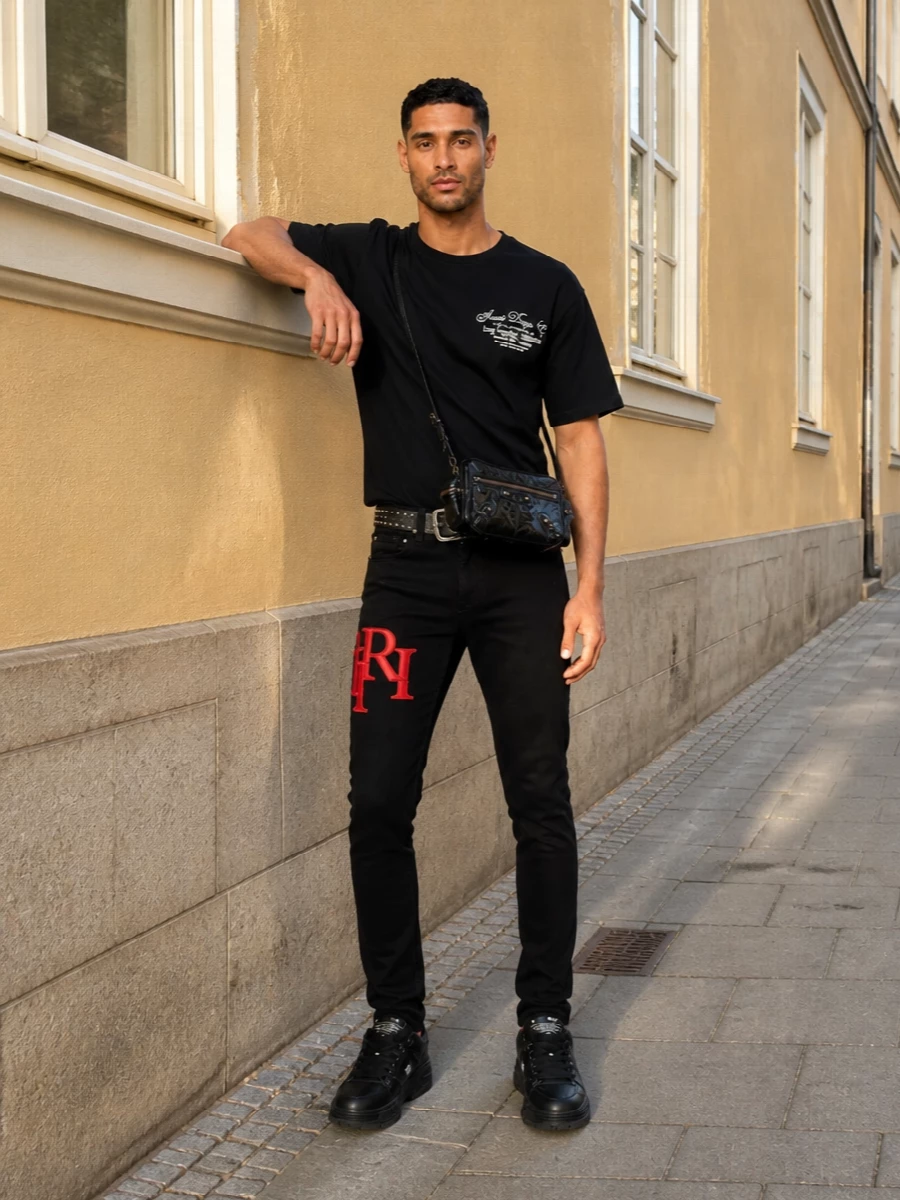 Amiri black skinny jeans logo streetwear outfit