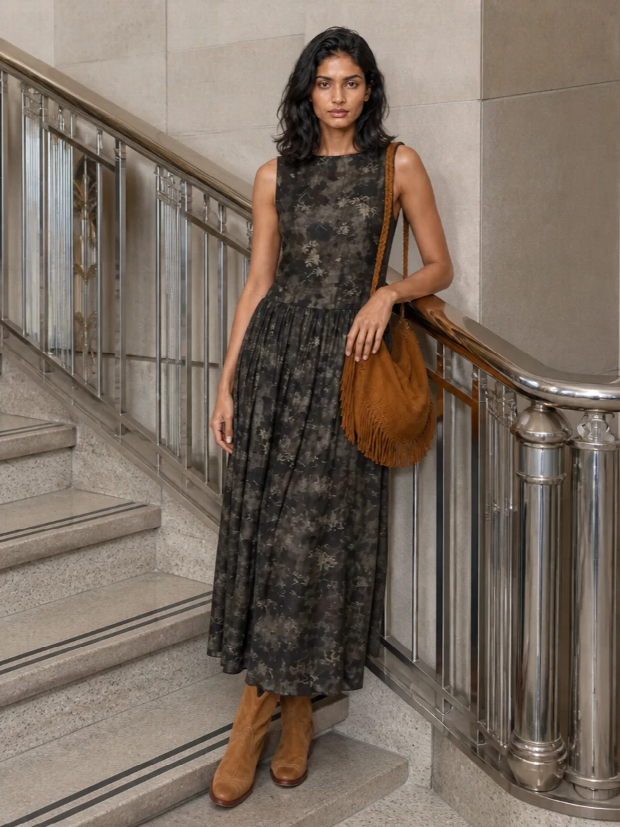 I’m building this around the dress path so the bag’s fringe and suede really read against a long, moody floral column. The Uma Wang maxi and camel Western boots keep everything earthy and boho, with just enough structure at the waist and calf to balance the slouchy bucket shape. It feels like an art-forward fall outfit you can wear from daytime wandering to a low-lit dinner without changing a thing.