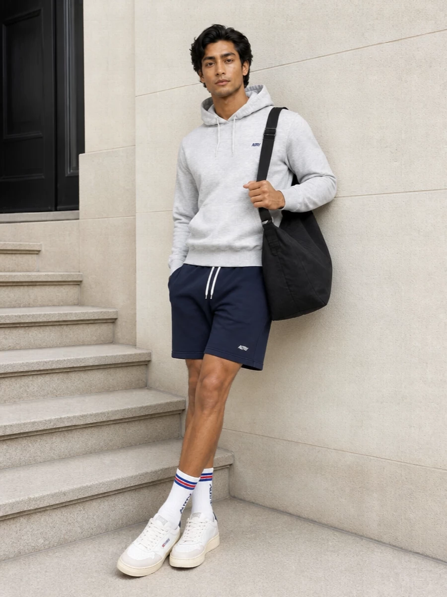 Autry hoodie navy shorts white sneakers outfit
