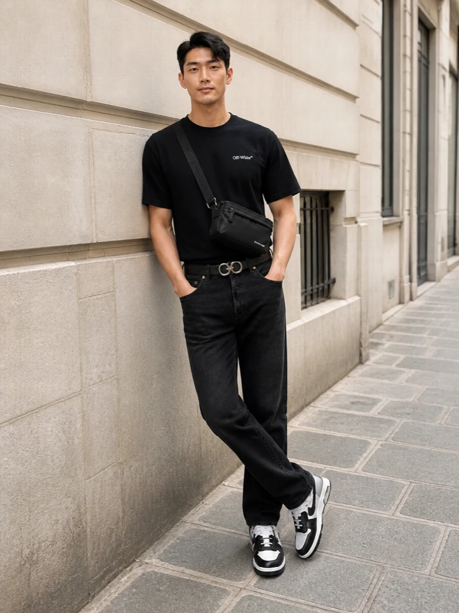 This look centres on the black Off-White tee, grounded with washed-black straight-leg denim for a clean, urban silhouette. Chunky monochrome Off-White sneakers reinforce the streetwear attitude, while the Givenchy belt bag and a polished Ferragamo belt add discreet luxury and structure without breaking the black-and-white language. It’s an easy, SS-ready uniform that feels intentional from every angle.