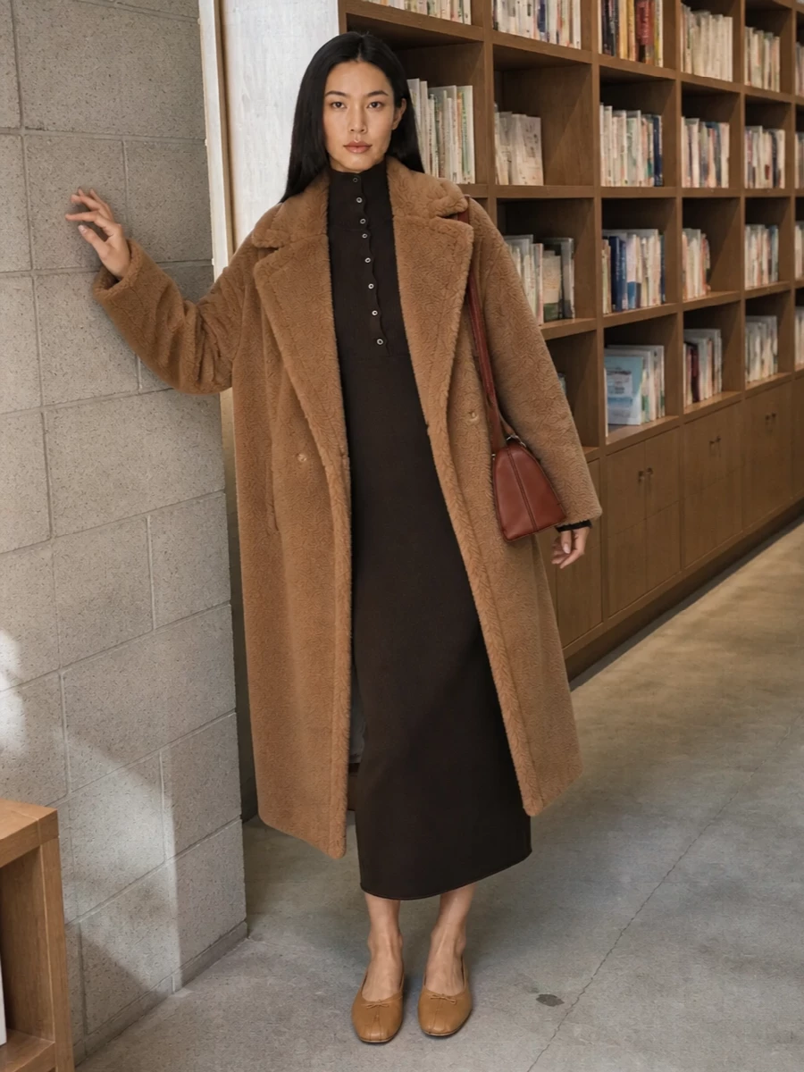I chose the dress path, pairing the oversized Max Mara teddy coat with a slim Tom Ford ribbed midi to play volume against a clean, elongating column. Camel Margiela ballerinas and a structured chestnut Marni shoulder bag keep everything tonally rich yet restrained, giving you a cocooning winter outfit that reads quietly expensive from day to dinner. The mix of textures does the talking so the palette can stay calm and warm.