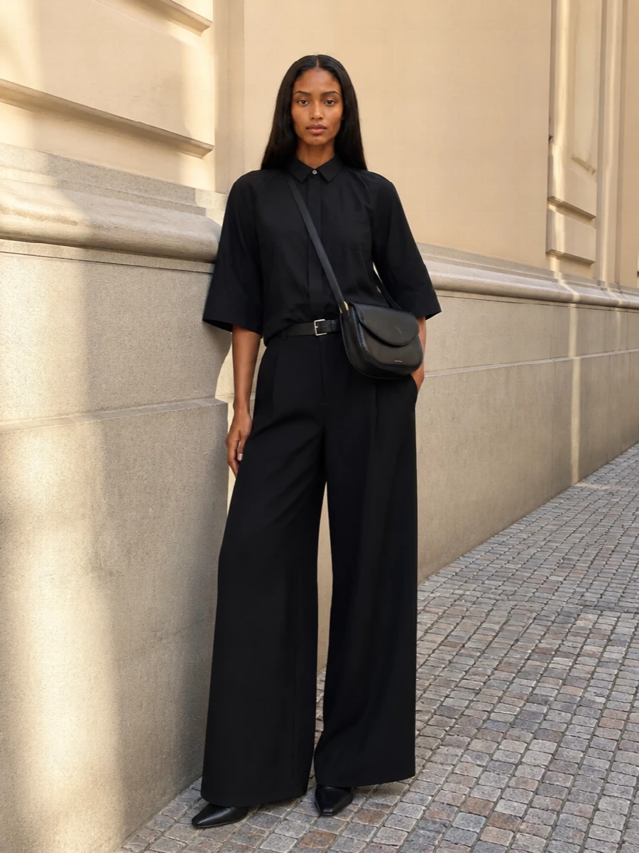 Sacai black shirt wide leg trousers sock boots