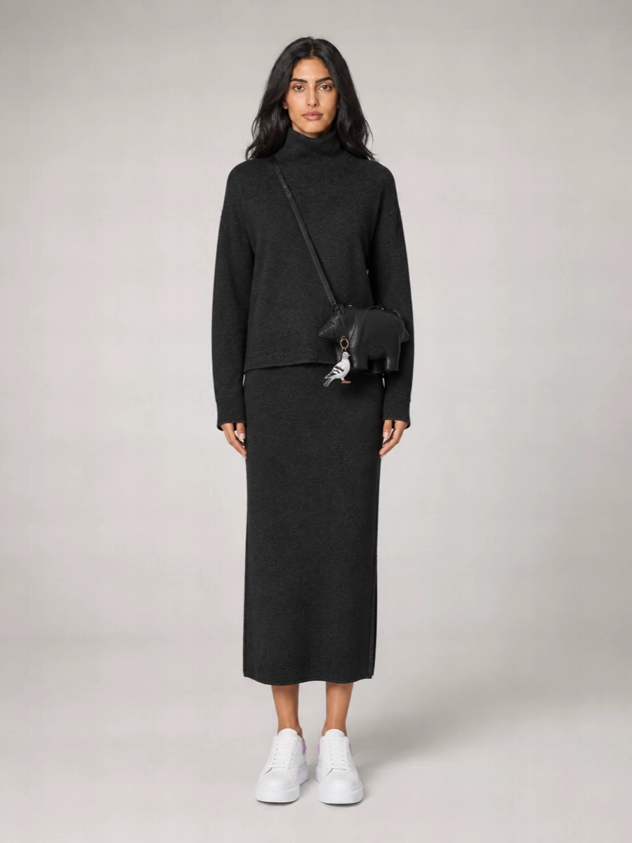 I went with the knit dress route so the pigeon charm can sit against a clean, tonal charcoal column rather than fight competing separates. The Givenchy dress, McQueen sneakers and Thom Browne novelty bag create a witty, city boho narrative in greys and soft whites, where the tiny bird reads as the final, knowing detail. It feels polished enough for art days yet relaxed and humorous, exactly where this charm lives best.