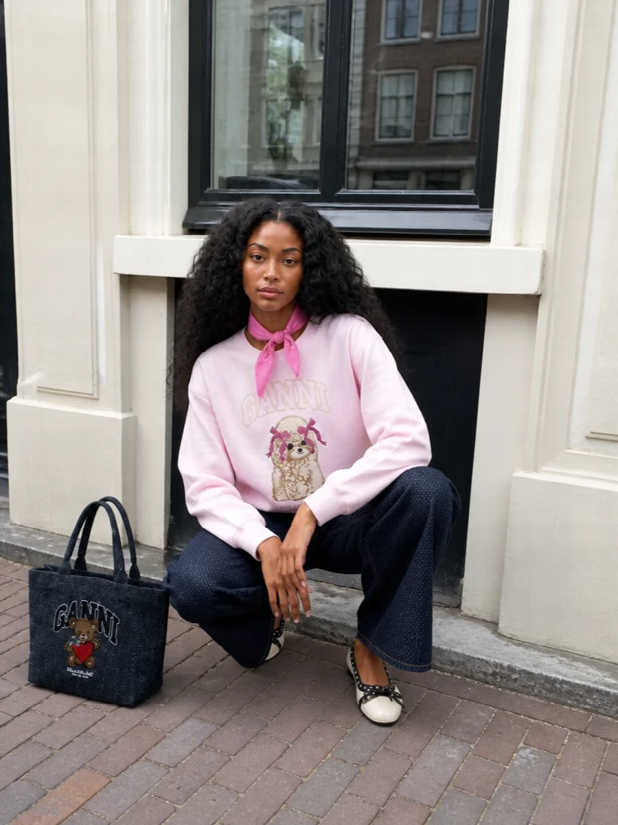 Ganni pink sweatshirt wide leg jeans outfit