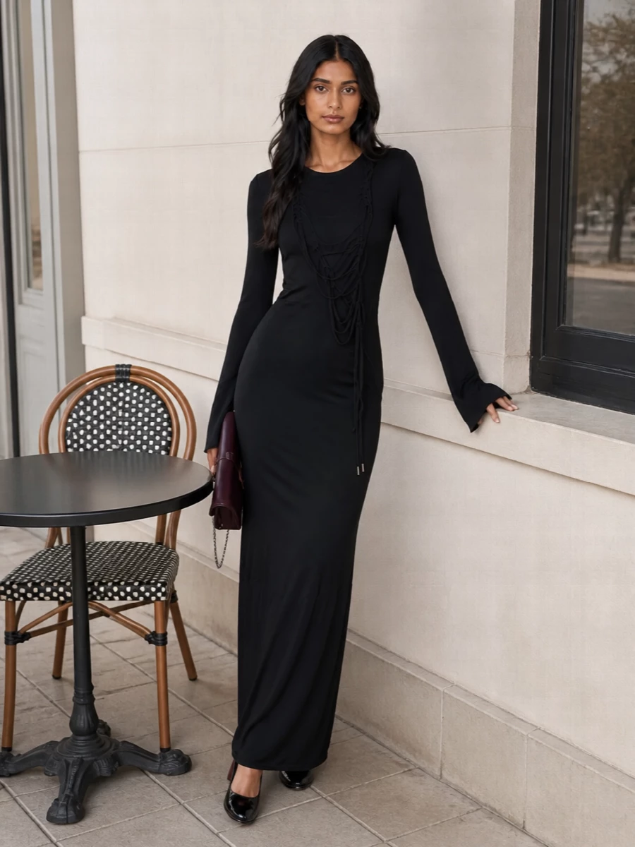I chose the dress route to keep the Louboutin pumps in their element, framing them with a single, elongated black column rather than breaking the line with tailoring separates. The Attico lace-up maxi brings a dark, fluid silhouette that feels quietly powerful, while the Roger Vivier clutch injects just enough deep color and texture to read considered rather than matchy. Together, it is a polished winter evening ensemble that feels modern, sensual and intentionally restrained around the shoes’ glossy structure.