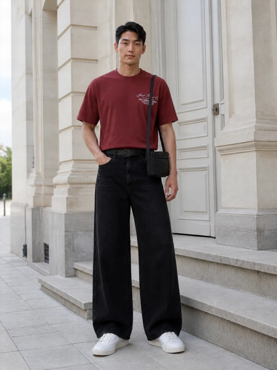 Amiri red tee wide leg black jeans outfit