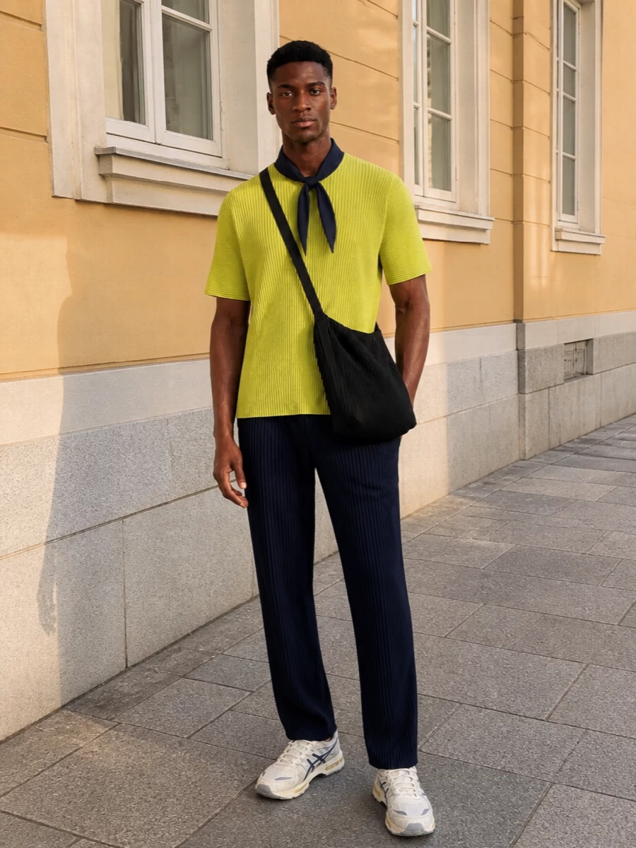 Homme plisse yellow pleated tee navy trousers