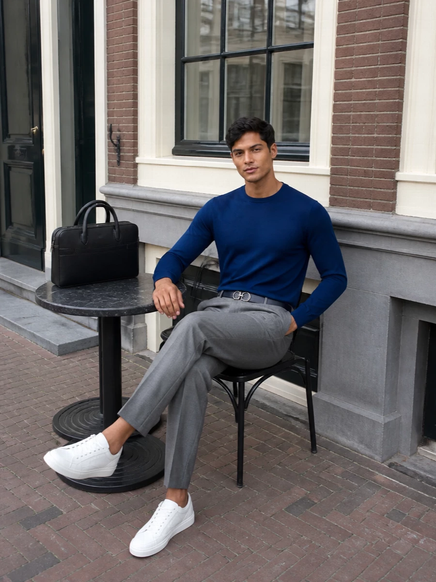 Ferragamo blue sweater grey trousers outfit
