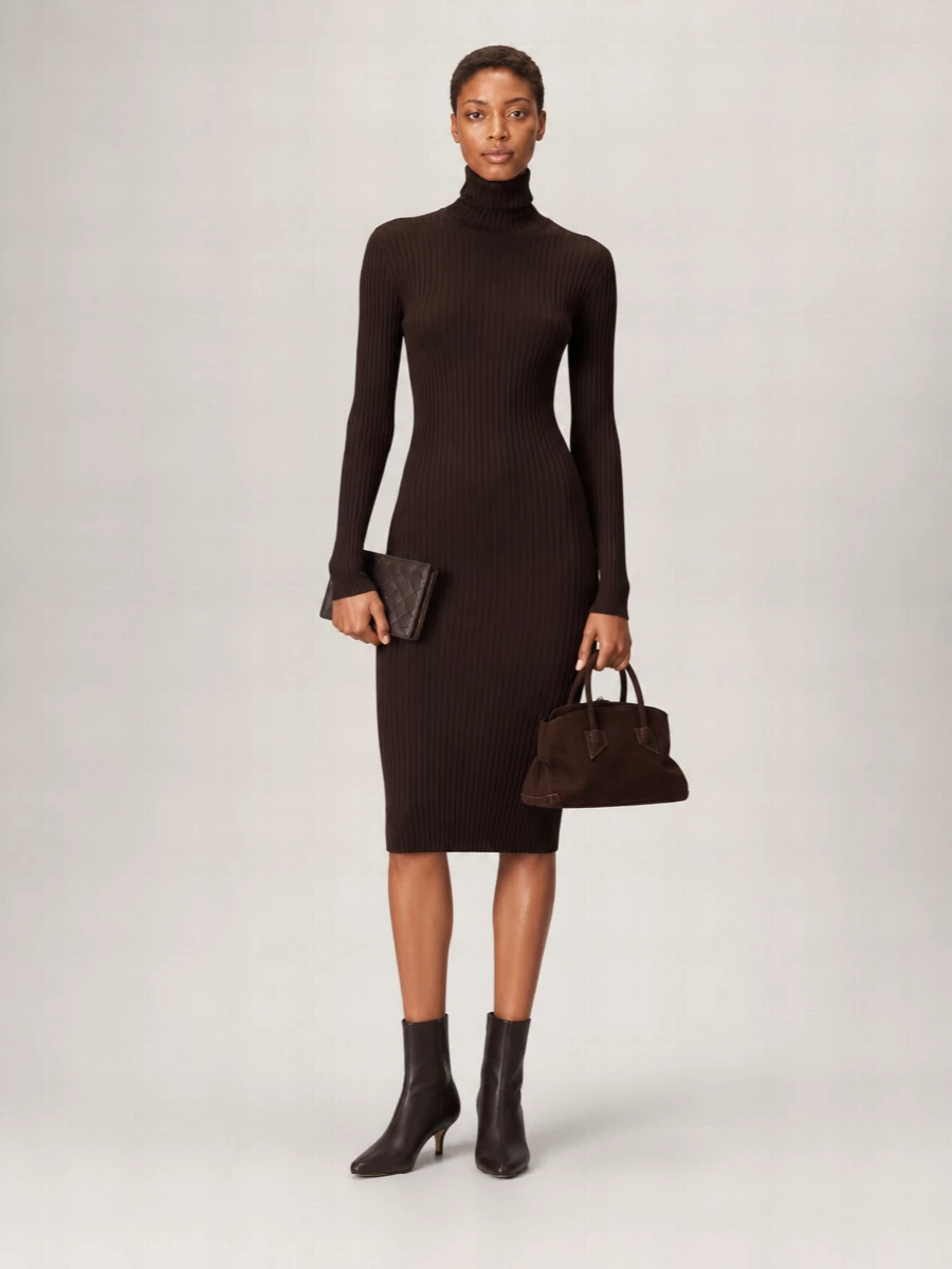 I chose the dress route to echo the cardholder’s slim, vertical proportion, letting a single chocolate column set the tone rather than breaking the line with separate top and trouser. The ribbed knit dress, espresso ankle boots and dark-brown suede tote build a minimalist, tonal story around the Bottega piece, reading quietly luxurious and city-appropriate for cooler seasons. Everything works in deep neutrals and clean shapes so the texture of the leather and knit does the talking instead of hardware or contrast color.