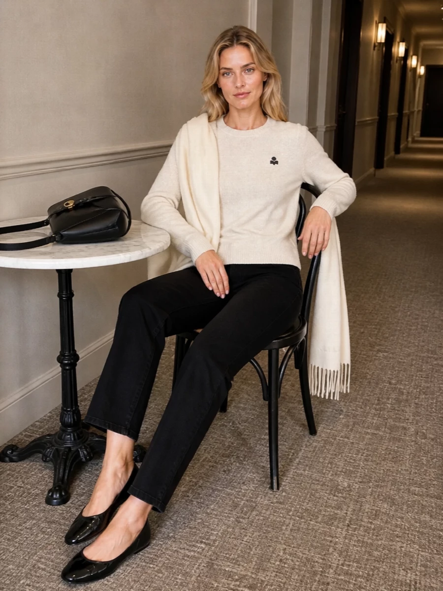 Oatmeal melange and inky black keep this Isabel Marant Étoile pairing calm and precise, ideal for understated city days. The straight-leg jean and ballet flat combination feels relaxed yet composed, letting the subtle logo details and pared-back shapes do the work. A structured black shoulder bag and tonal scarf quietly finish the equation for a polished, minimal everyday uniform.