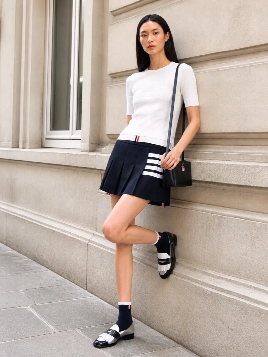 Thom browne white tee navy pleated mini skirt outfit