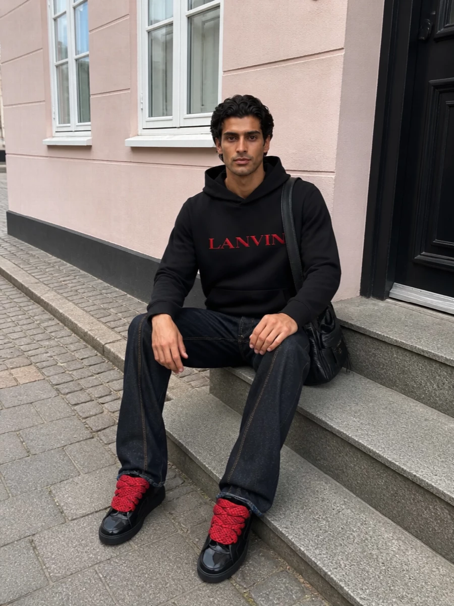Lanvin hoodie dark indigo jeans red high top sneakers
