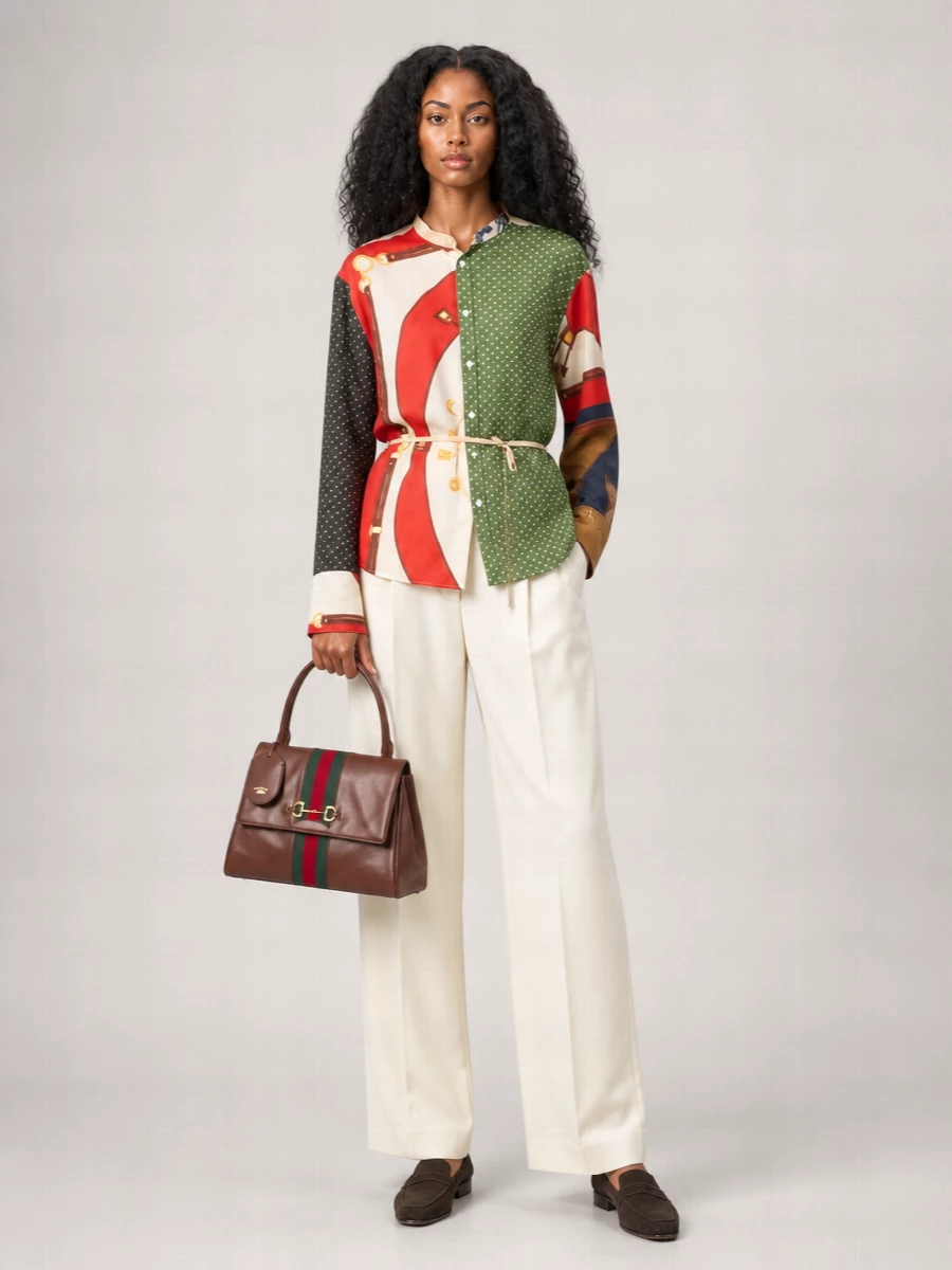 I’m building around the top and trouser rather than a dress so the Gucci bag can sit against a clean, tailored canvas and feel quietly authoritative for day. The Celine scarf-print silk shirt picks up the bag’s deep green and red tones, which the ivory Giorgio Armani trouser then softens into something light for the season. Dark chocolate Giorgio Armani loafers ground everything in a refined, city-ready way that feels polished without reading overly formal.