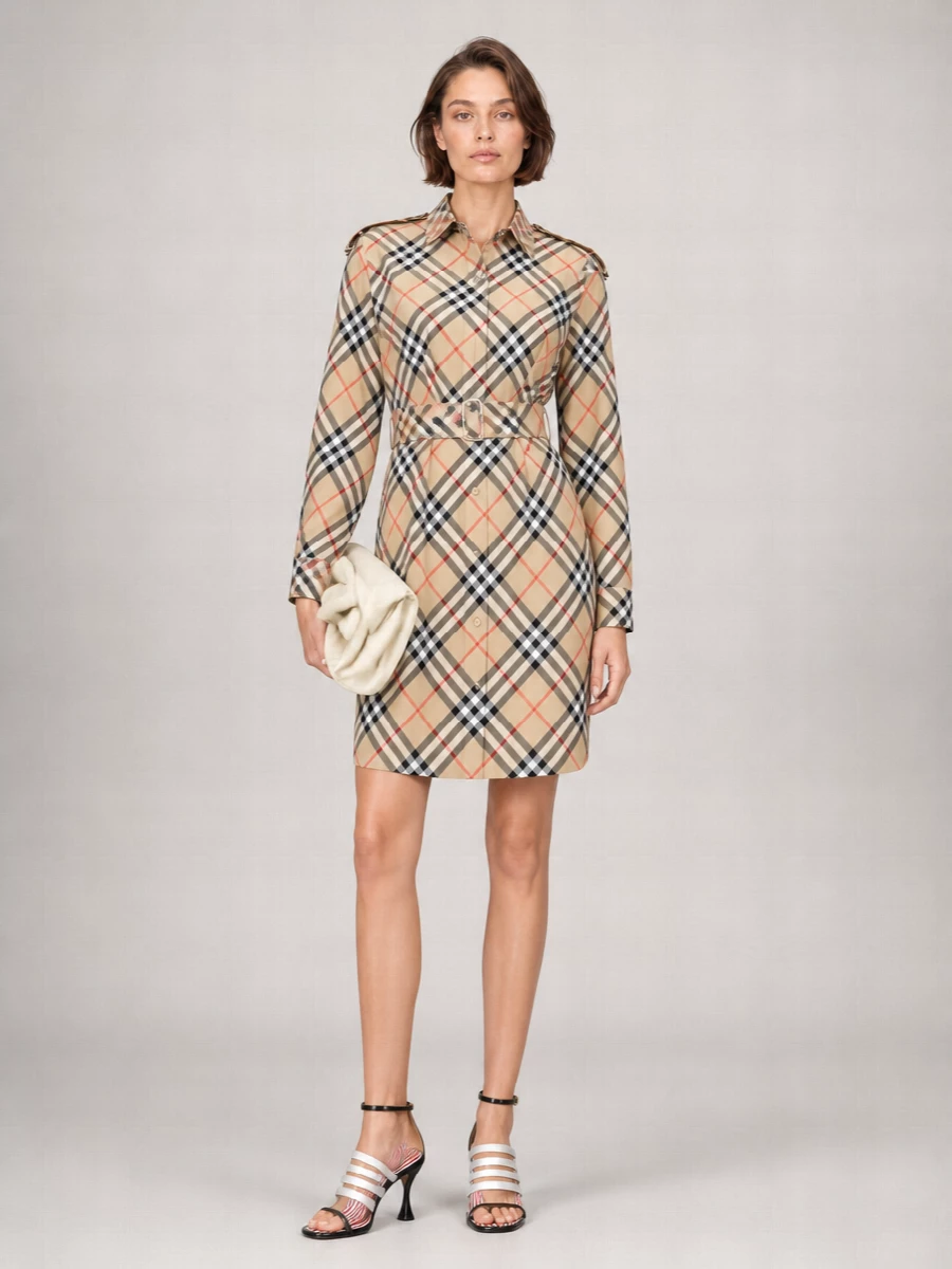 This outfit leans into a sharp, preppy narrative by pairing the graphic Thom Browne sandals with Burberry’s checked belted shirt dress, treating stripes and checks as a considered motif rather than a clash. The dress’s trench details and cinched waist balance the sandals’ sculptural heel, creating a tailored yet easy silhouette that works for daytime occasions that can slide into evening. Choosing the dress path keeps the story clean and confident, avoiding extra tailoring on top and bottom that would fight against the shoes’ strong architectural line.