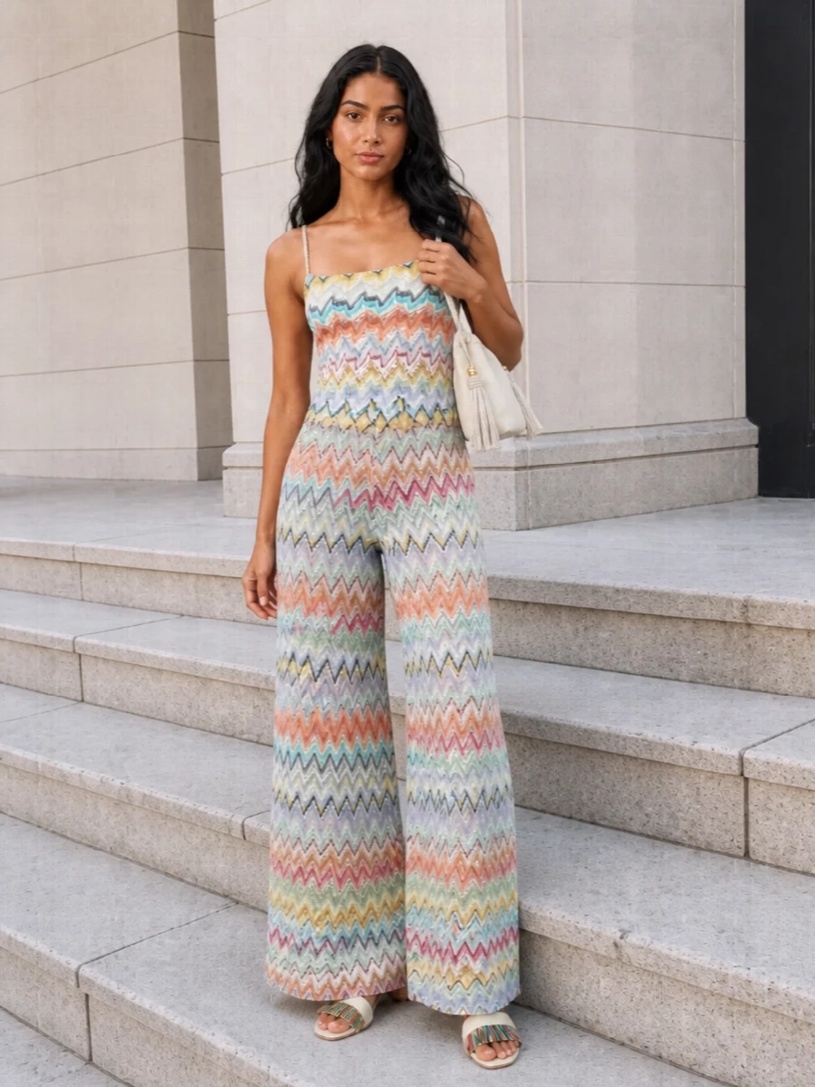 A sorbet Missoni-on-Missoni pairing turns the wide-leg knit pant into a relaxed yet glamorous set, the fitted chevron body keeping the volume grounded and the waist defined. Sculptural ivory slides and a small cream bucket bag keep the mood playful but polished, while a soft neutral scarf is there if you want a little extra warmth without losing the lightness.