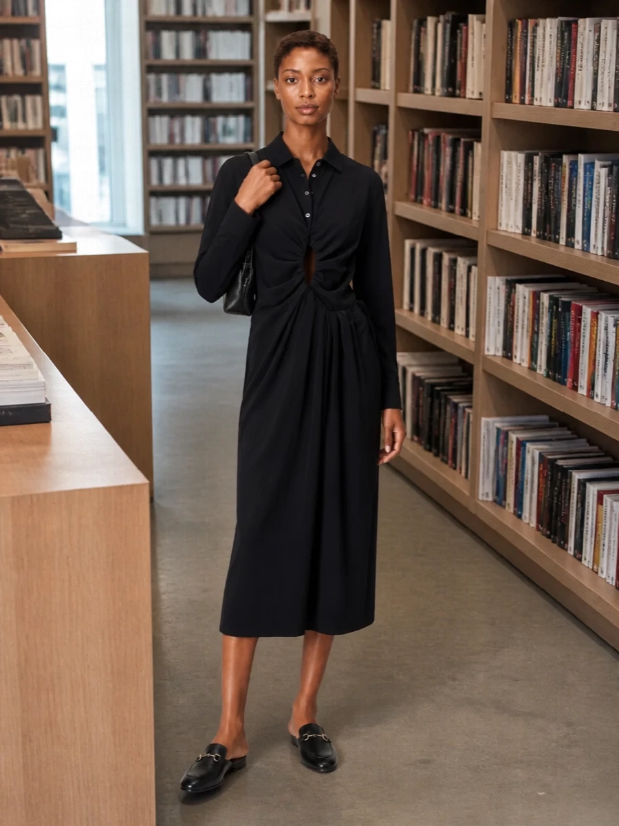 A Margiela black shirt dress with artful ruching and a clean midi line gives the Gucci mules a precise, modern frame. The result is quietly sensual and boardroom-to-gallery ready, with the soft leather flats undercutting any stiffness. A slim black clutch in the same restrained register keeps everything in the realm of sharp, minimalist polish.