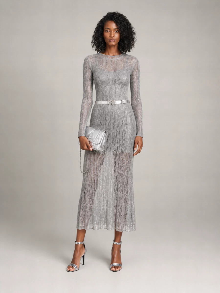 This is a full-silver, nightclub-ready moment that lets the Gucci belt slice cleanly across a fluid Alaïa metallic knit, giving pure column drama with a y2k edge. Mirrored Alaïa heels and a McQueen silver bag keep everything in the same high-shine register, so the crystals read intentional rather than overdone. A dress path beats separates here because the single elongated silhouette lets all that metal and sparkle feel sleek instead of busy.