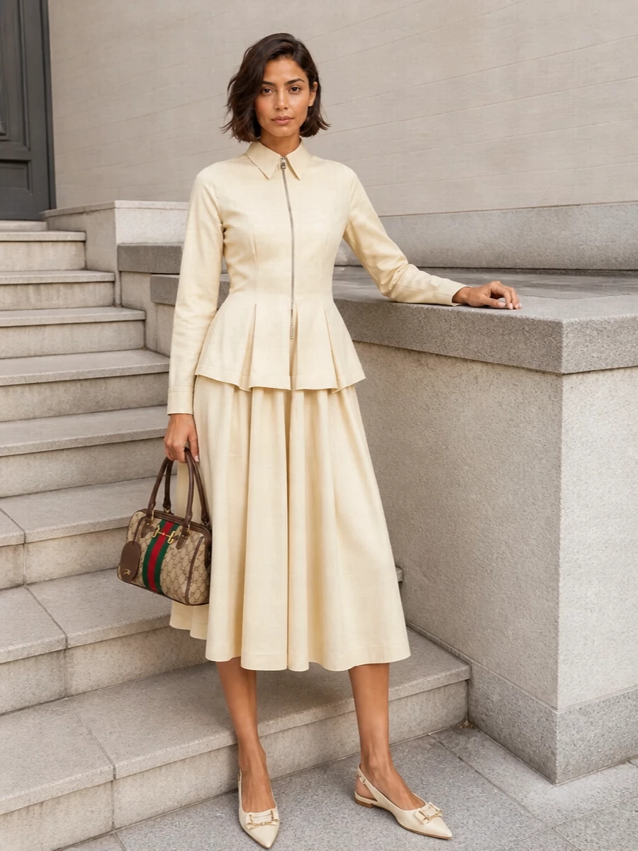 A buttercream Bottega shirt-dress and the Gucci canvas shoulder bag create a quietly structured, all-Italian neutral story that feels considered without trying too hard. The sculpted peplum and pleated skirt give movement while the bag’s web stripe adds just enough color and heritage detail. Ivory slingback flats keep the mood polished yet relaxed, ideal for daytime meetings that might drift into dinner.
