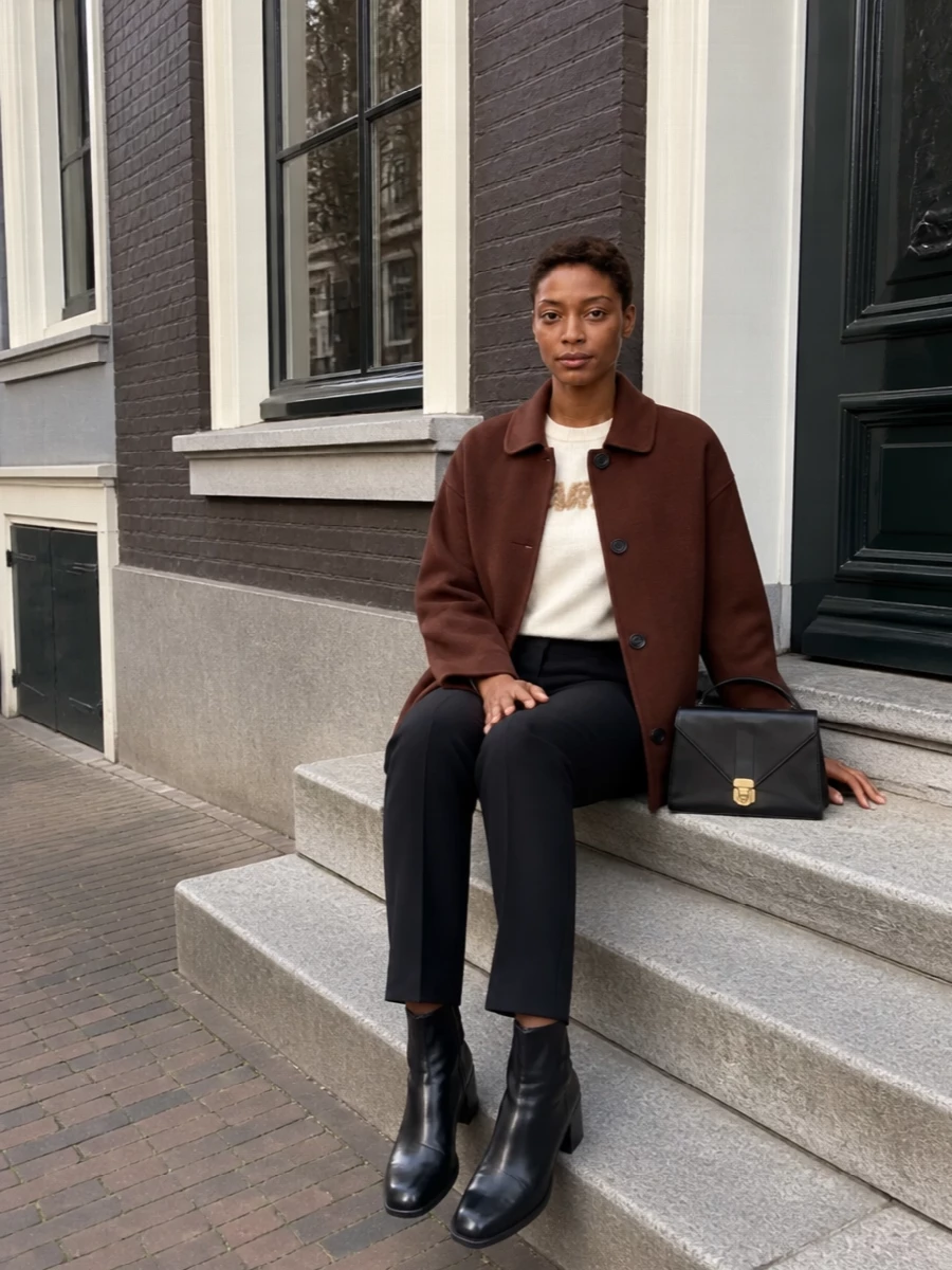 Marni chestnut coat ivory sweater black trousers