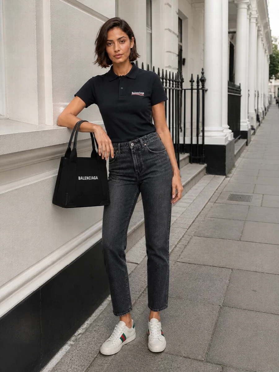 This is a clean, city-ready take on sporty streetwear: a navy logo polo and charcoal cropped denim framing the Gucci low-tops. The proportions stay sharp and easy, with the straight-leg jean showing just enough of the sneaker while the structured Balenciaga tote keeps everything feeling intentional, not loungey. I chose the top-and-bottom route to echo the sneakers’ preppy sport energy, which plays better with denim and a polo than with the more statement dresses.
