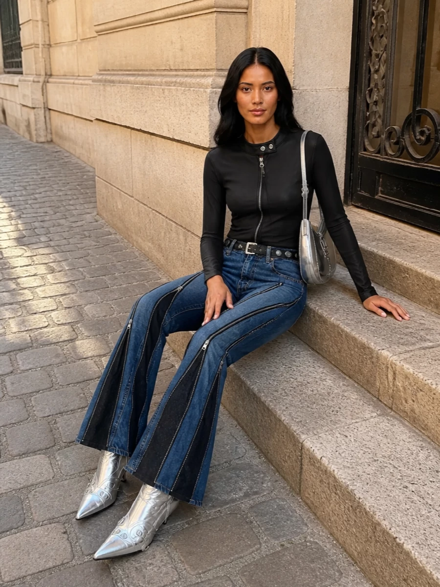 This is pure after-dark denim armor, with Junya’s zip-slashed flares anchored by a slick Courrèges long sleeve and knife-sharp Balenciaga silver boots. The metallic Versace crescent and studded Prada belt keep the hardware story consistent, so everything reads intentional, not busy. It is high-impact, club-ready and tightly edited in black, indigo and chrome.