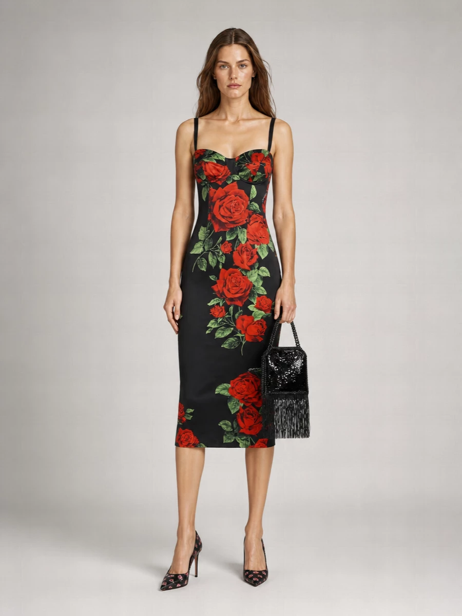 Dolce & Gabbana’s rose-print dress stays firmly in focus, framed by Prada’s coordinating floral pump and a sliver of black sequin fringe at the wrist. The palette stays deep and romantic, with texture and movement doing the work instead of extra color. It is unapologetically sensual, tailored and ready for a winter cocktail party or late dinner in the city.