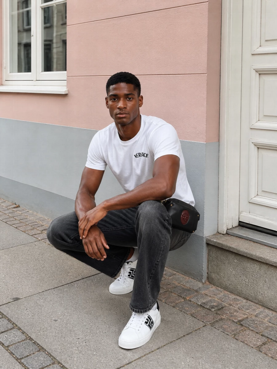 Versace white logo tee black jeans outfit
