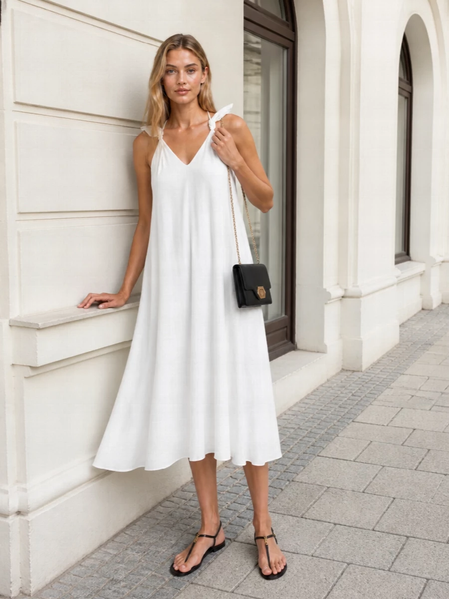 I anchored this with the Loewe halter dress rather than separates so the Fendi sandal can sit against one clean, fluid column of white and stay the focal point. The Lanvin black flap bag picks up the sandal’s black and gold, giving just enough structure without disturbing the softness of the dress. The result is a quietly polished warm-weather ensemble that moves easily from long lunches to relaxed evening drinks in the city or by the water.