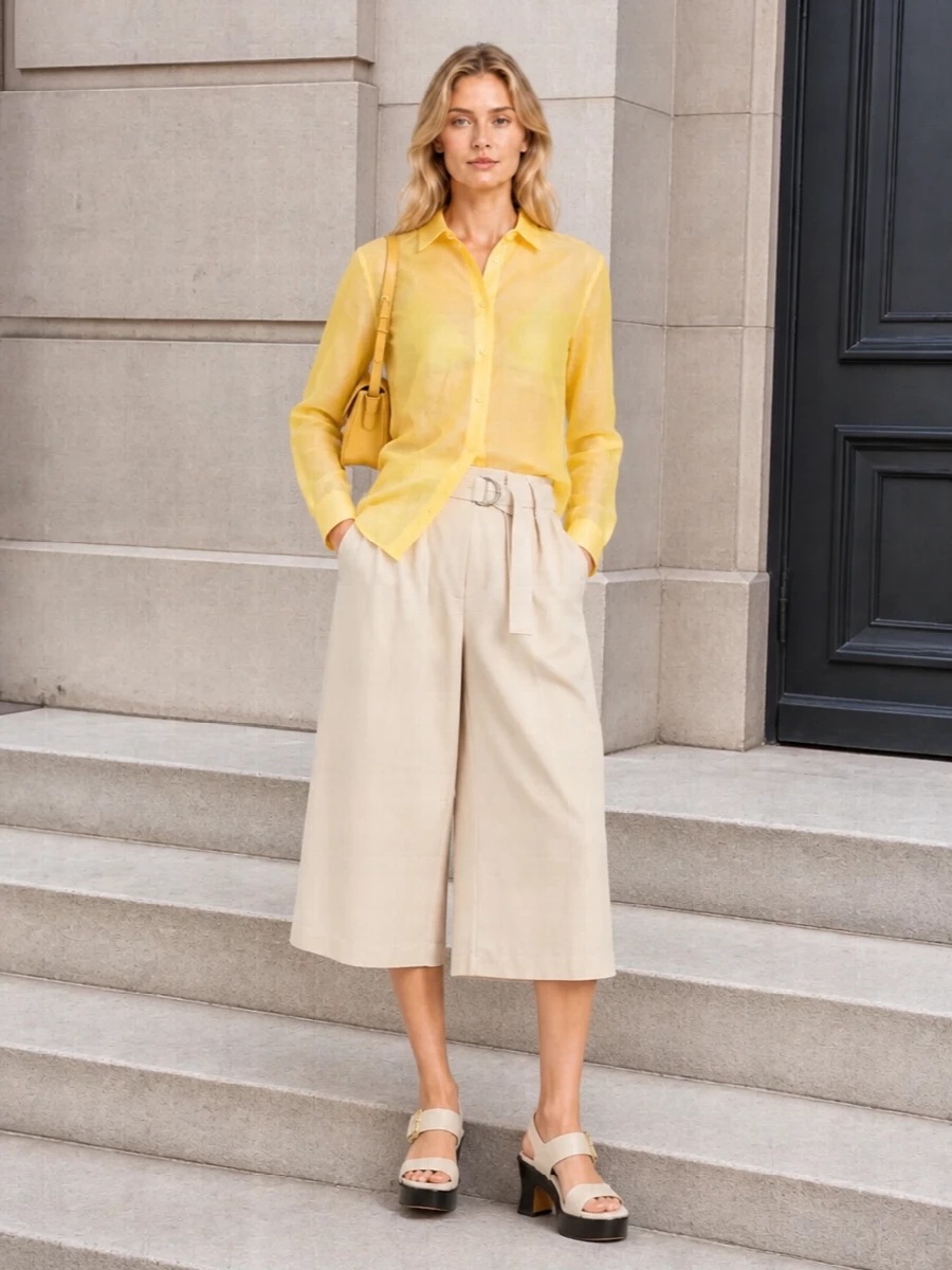 Loewe yellow shirt beige culotte shorts outfit