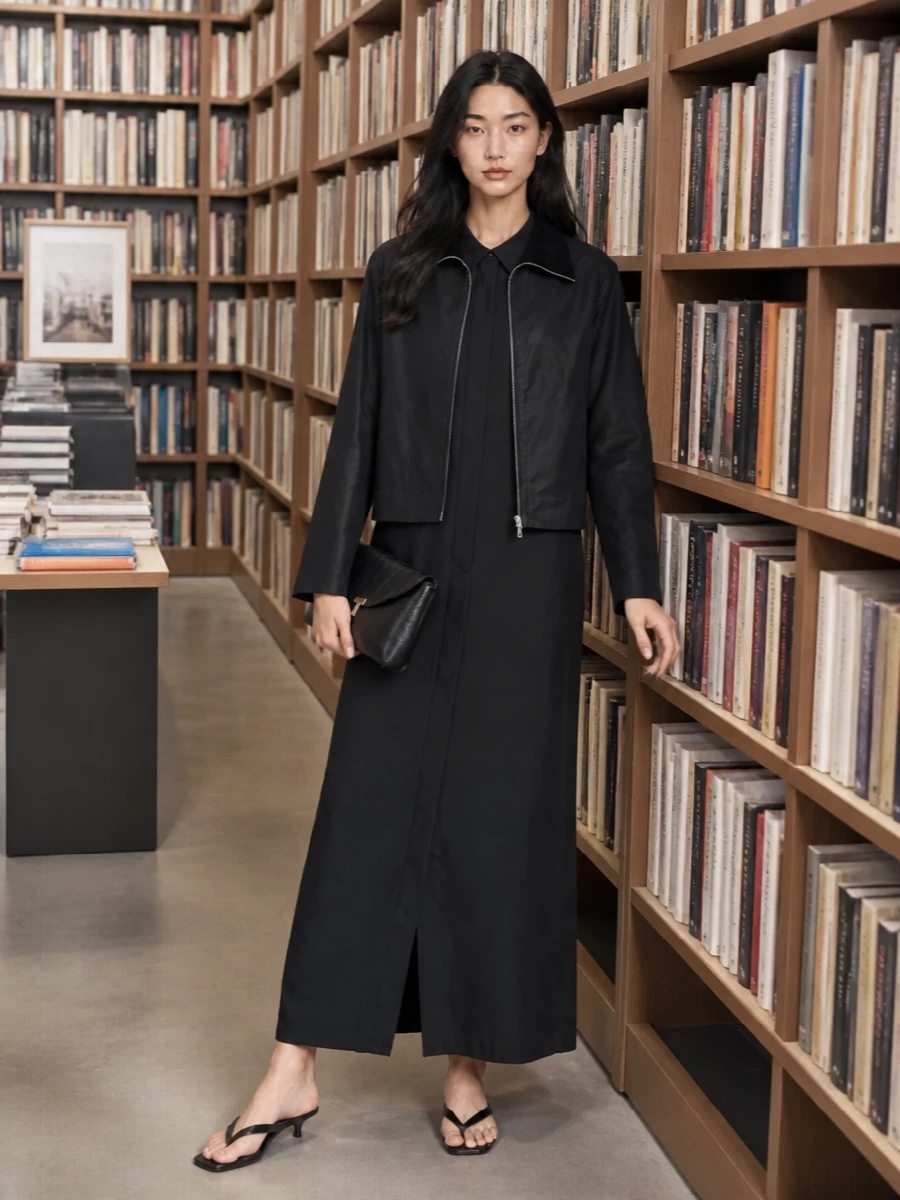 I’m taking the dress route here, because the cropped Totême jacket is at its best over a long, fluid column rather than broken up with a separate top and trouser. The black shirt dress keeps the story graphic and pared back, while the kitten-heel thong and envelope clutch add just enough formality for gallery evenings or intimate city dinners without tipping into fuss.